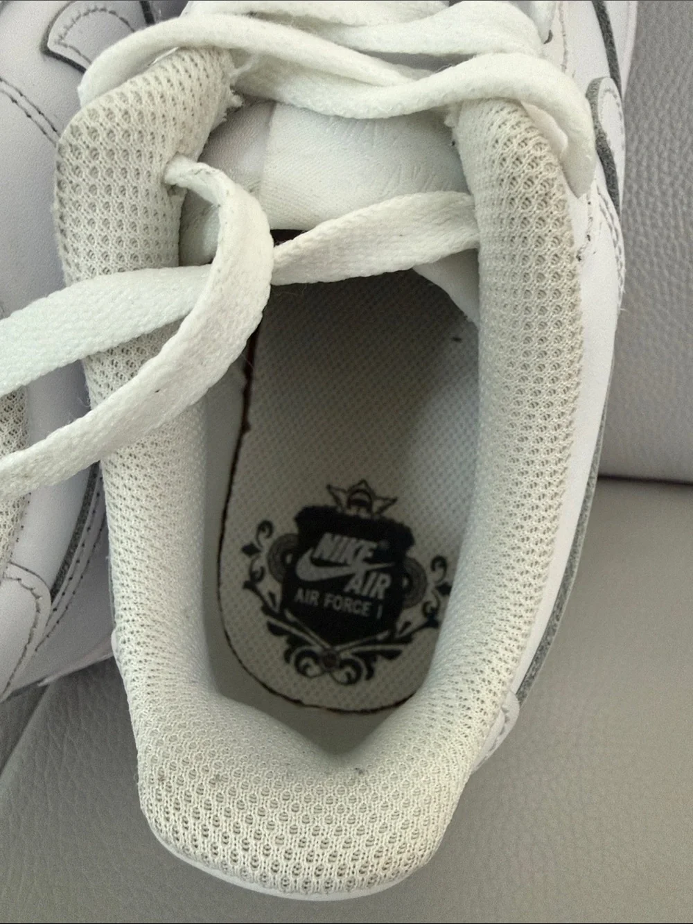 Nike Kids White Leather Sneakers with Subtle Silver Accents